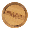 Wooden round cutting board with 'The Millers Est. 2019' engraving on a white background